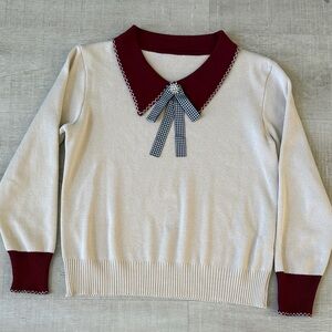 Elegant Cream Knit with Burgundy Collar and Bow detail